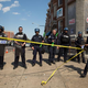An officer rolls out police tape as other officers form a line to block North Avenue in Baltimore May 4, 2015, near the site of recent riots, and only several blocks away from where Freddie Gray was arrested April 12.
Allison Shelley/Getty Images